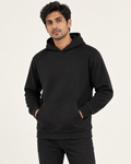 Men’s black Qikink UH83 pullover hoodie on model