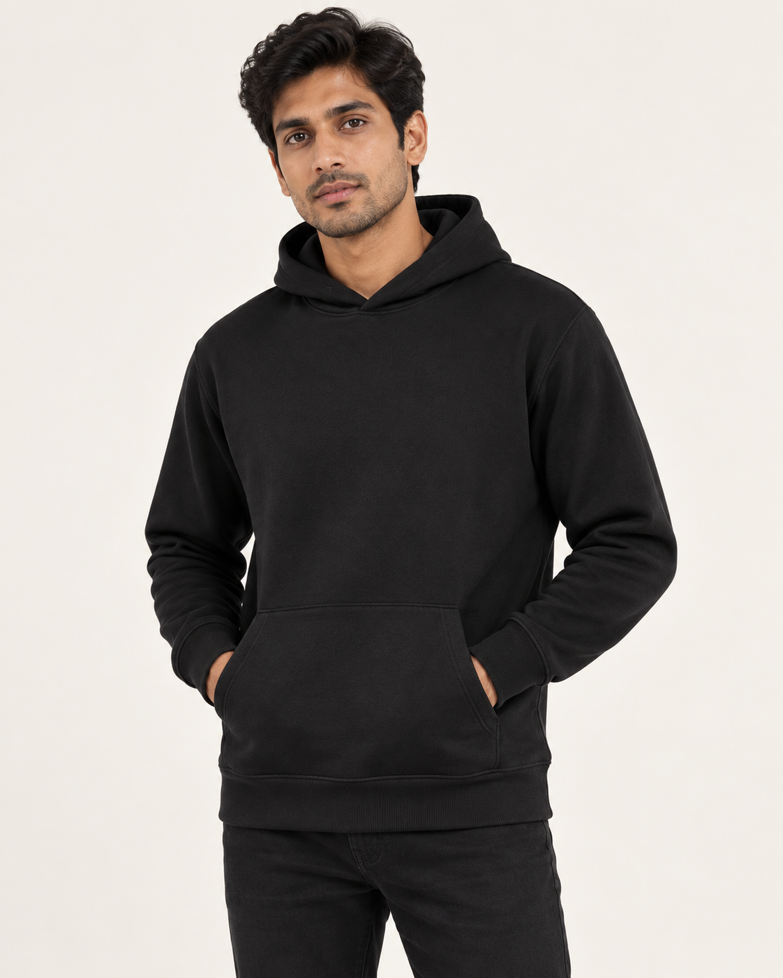 Men’s black Qikink UH83 pullover hoodie on model