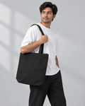 Men’s black Qikink cotton canvas zipper tote on model