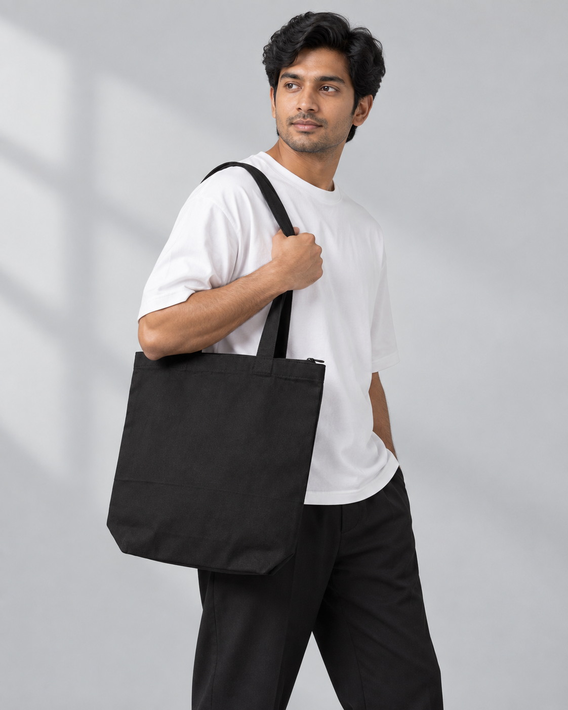 Men’s black Qikink cotton canvas zipper tote on model