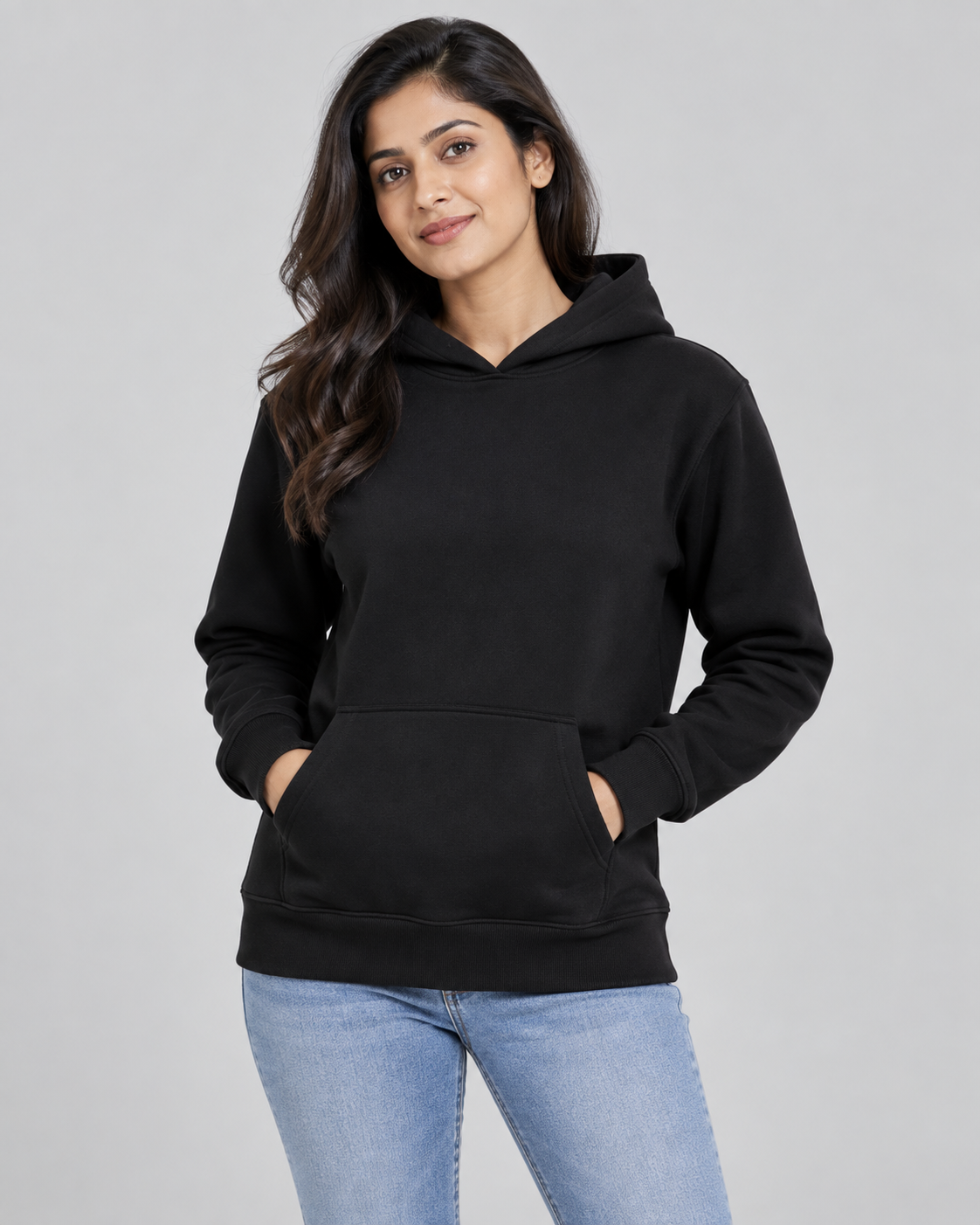 Women’s black Qikink UH83 pullover hoodie on model