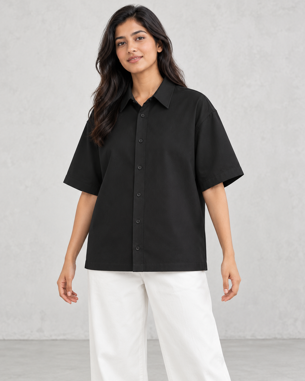 Women’s black oversized cotton shirt on model