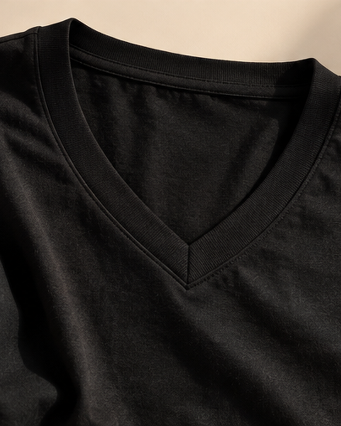Black V-neck cotton tee neckline and fabric detail